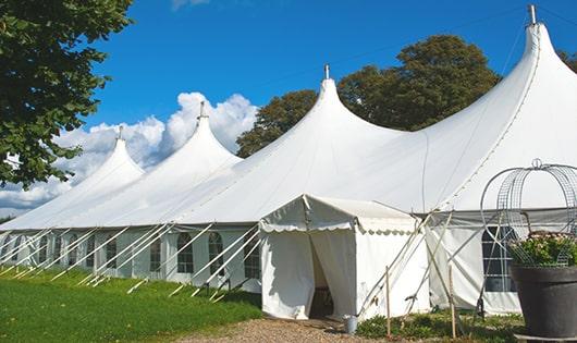 a line of sleek and modern porta potties ready for use at an upscale corporate event in Dorchester Center